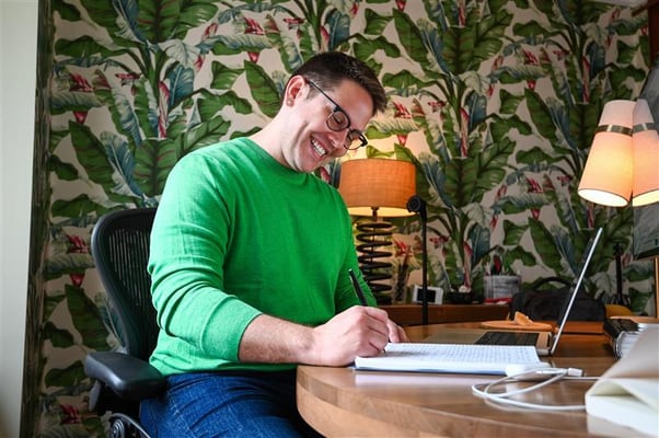 Julio G. Alvarez writes at his desk